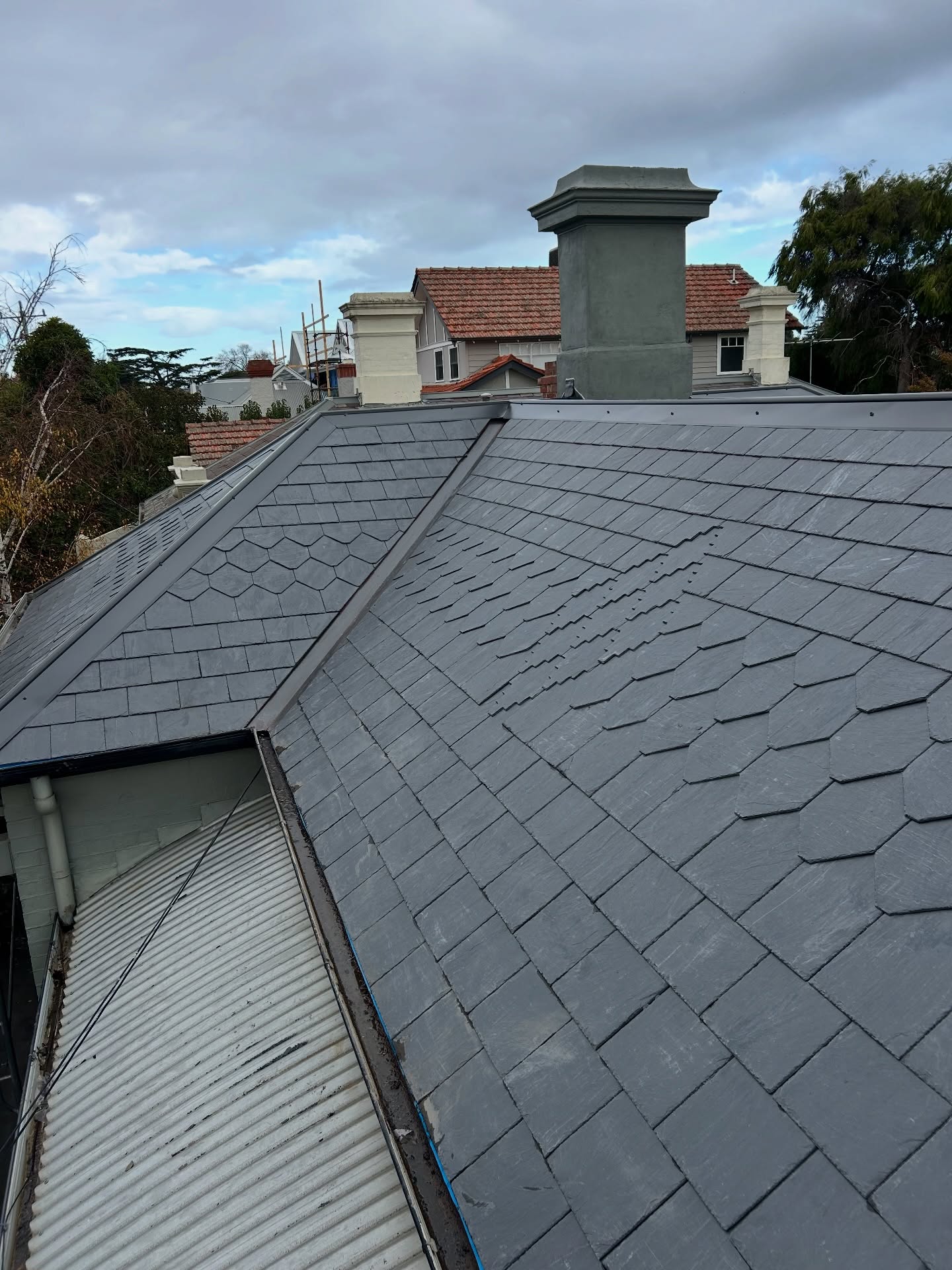 A Reroof complete in Brighton, old welsh slates stripped off replaced with new Canadian slates, pattern slates installed as requested, came out lovely 🏠🔨 #slates #canadianslate #leadwork #roofing #building